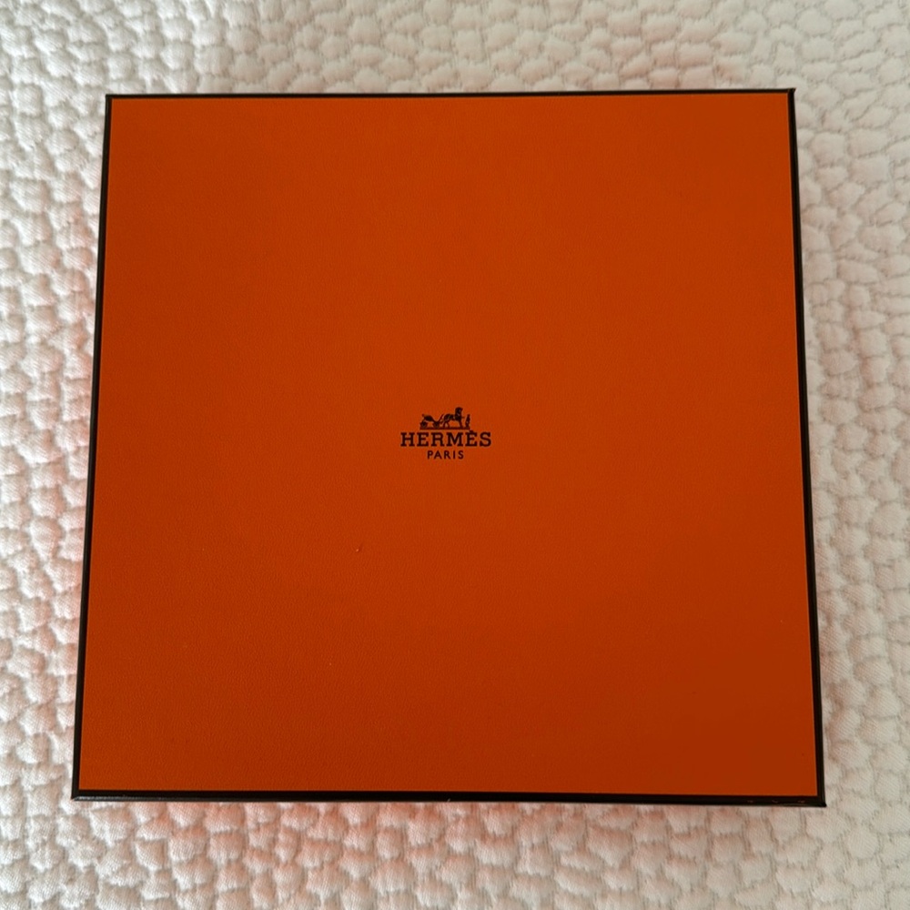 Authentic Hermes box with paper and ribbon.